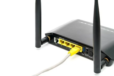 Black wireless router with local area network cable isolated on white backg.. 写真素材