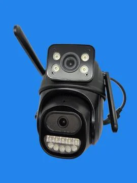 Black wireless security camera with dual lenses and LED lights isolated on .. Stock Photos