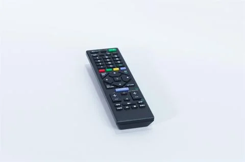 Black Wireless TV Remote Control Placed on a Clean White Surface Stock Photos