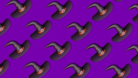Black witch hats with orange bands and square buckles move in a repeating Stock Footage 346045476