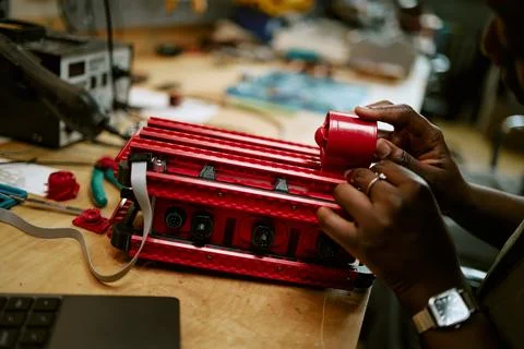 Black Woman Assembling Robotic Hardware Prototype in Tech Lab Stock Photos