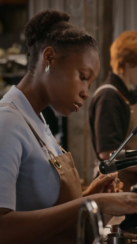 Black Woman Barista Operating Espresso Machine in Coffee Shop Stock Footage 344364853