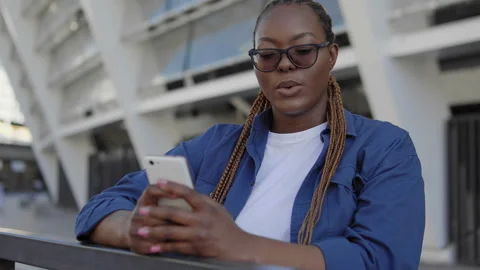 Black woman becoming angry reading message on smartphone, connection problems Stock Footage