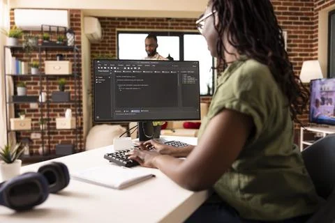 Black woman coding on computer Stock Photos