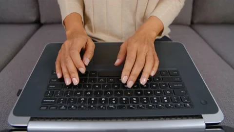 Black woman coding on notebook computer in wide angle video clip Video stock 231063738