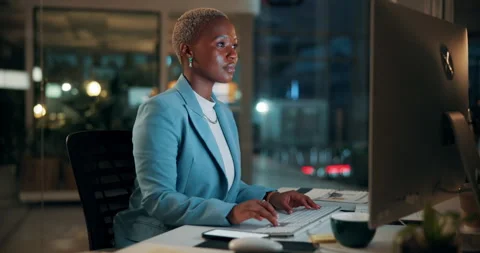 Black woman, computer and typing in office at night for research, finance chat Stock Footage 336307703