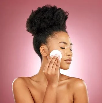 Black woman, cotton pad and dermatology with makeup, facial and salon treatment Stock Photos
