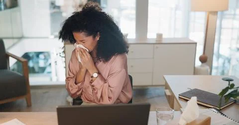 Black woman, covid and sinus in office with sneeze, tissue and runny nose while Stock Photos