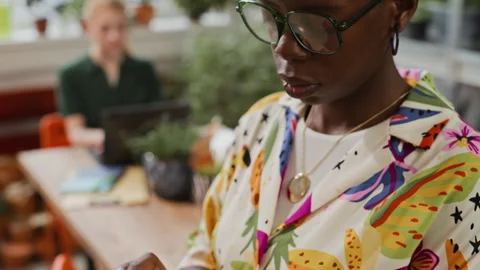 Black Woman Designer Using Tablet Computer in Modern Office 動画素材 339498905