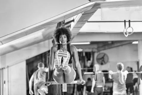 Black woman doing parallel bars Exercise 스톡 사진