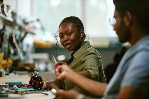 Black Woman Engineer Developing Robotics in Technology Lab Stock Photos