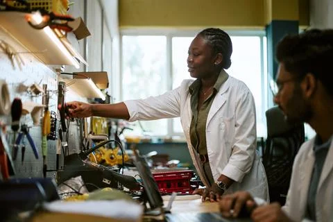 Black Woman Engineer Selecting Tools in Modern Laboratory Stock Photos