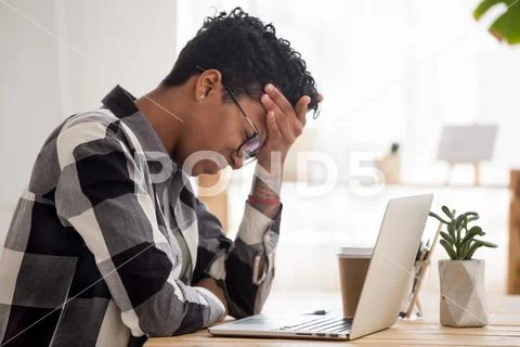 Black woman feels unwell have problems in work Stock Photos