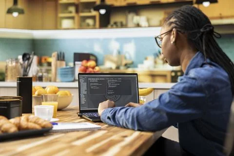 Black woman programmer, developing web code, software systems Stock Photos