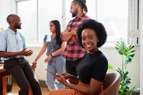 Black woman in tech, chatting to coding colleagues informal meeting in office Stock Photos