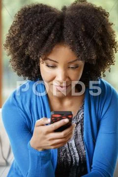 Black Woman Texting On Cell Phone
