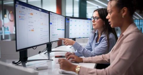 Black Woman Using Payroll Software To Manage Diverse Staffing Company. Stock Photos