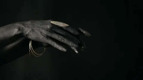 Black woman's hands with many different Silver jewelry. Oriental Bracelets on Video stock 100681383