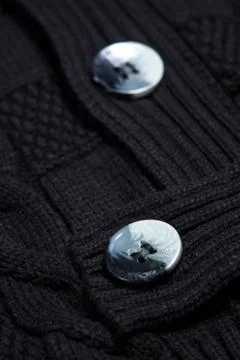 Black wool knit with two buttons.  Stock Photos