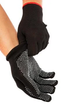 Black work gloves on hands isolated on white background. Stock Photos