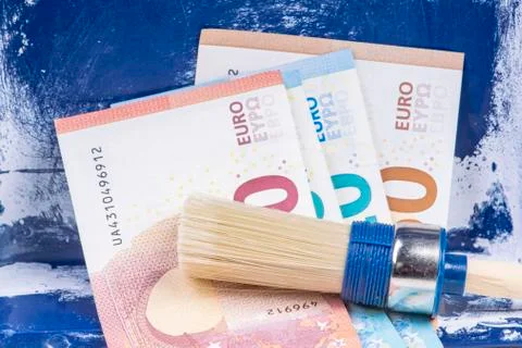 Black work painter brush with banknotes Stock Photos