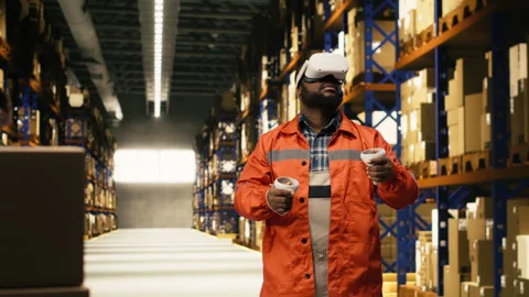 Black worker practices parcel scanning in VR environment with headset Stock Footage 332909348