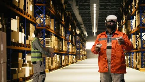 Black worker practices parcel scanning in VR environment with headset Stock Photos