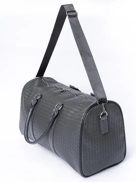 Black woven pattern duffel bag Stock Photos