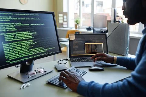 Black Young Man Writing Computer Code 스톡 사진