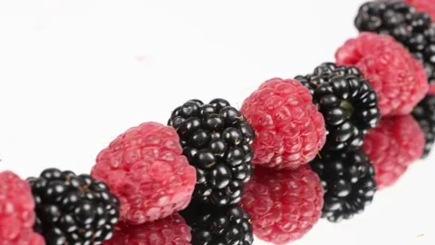 Blackberry and raspberry with reflection on white background. Stock Footage 237858570