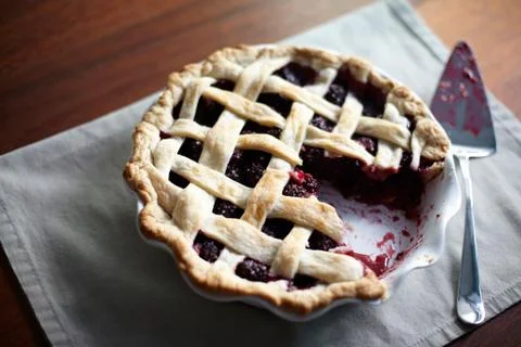 Blackberry pie with missing slice Stock Photos