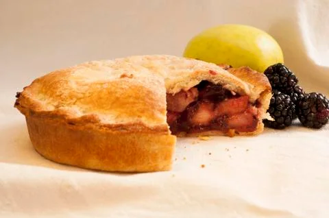 Blackberry Pie with Slice Missing and Fruits Stock Photos