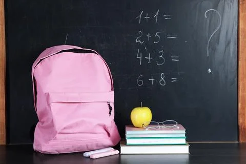 Blackboard with addition problems to solve, backpack, notebooks, highlighte.. 写真素材