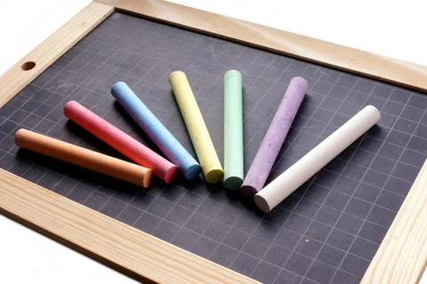 Blackboard and Coloured Chalks Stock Photos