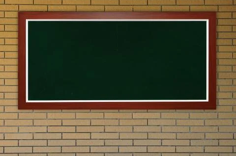 Blackboard at bricks wall Stock Photos