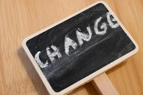 Blackboard with chalk text "Change", concept of transformation or improvement, C Fotos Stock