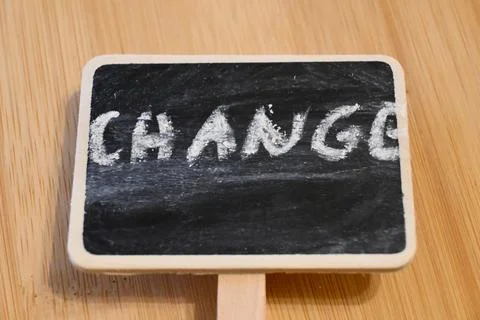 Blackboard with chalk text "Change", concept of transformation or improvement, C Fotos Stock
