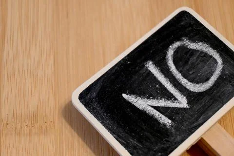 Blackboard with chalk text "No", concept of refusal or negation, Copy Space Photos