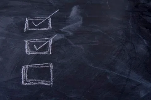 Blackboard with check boxes checked and unchecked Stock Photos