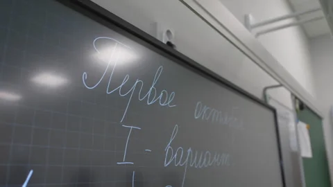 Blackboard covered with handwritten control work assignments Stock Footage 310240980