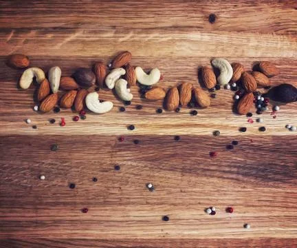 Blackboard with nuts for text Stock Photos
