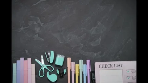 Blackboard with pastel statyoneries in the bottom. Large place for text. StopMo Stock Footage 283683316