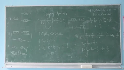 Blackboard in a school classroom with physics and electrical engineering tasks Видео 341776277
