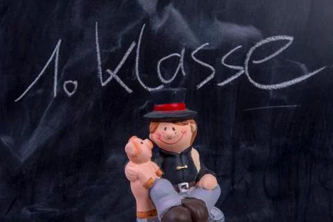 Blackboard with the text first class and good luck Stock Photos