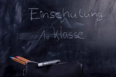 Blackboard with text "induction school first class" Stock Photos