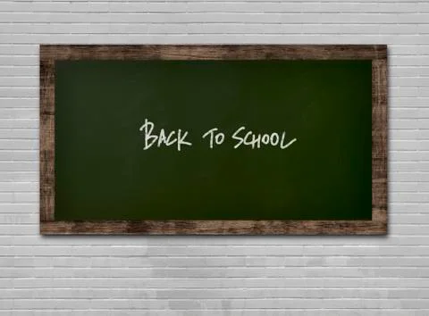 Blackboard on a wall with "Back to School" text on it Stock Photos