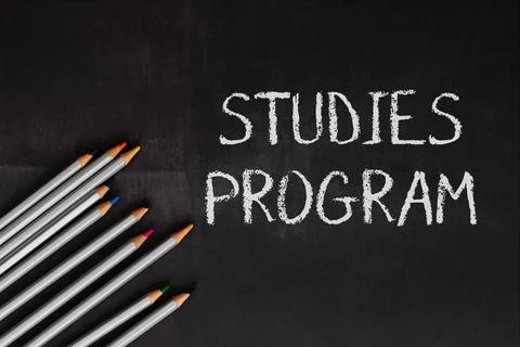 Blackboard with the word studies program written on it Stock Photos