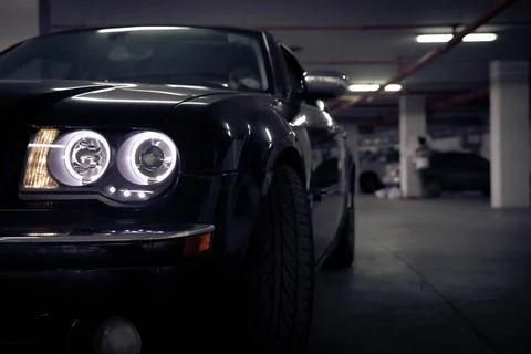 A,Black,Car,In,Parking Stock Photos