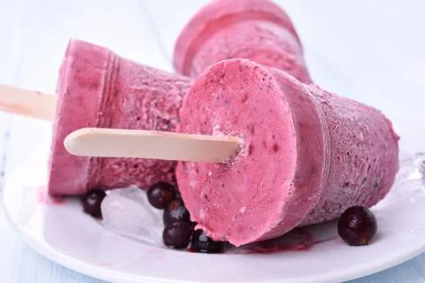 Blackcurrant blueberry popsicles Stock Photos