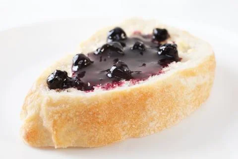 Blackcurrant jam on bread Stock Photos